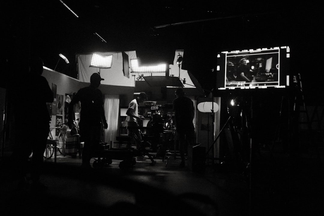 Wide shot of an empty television news studio set with cameras and lighting rigs